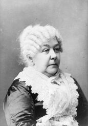 Elizabeth Cady Stanton seated with stern expression